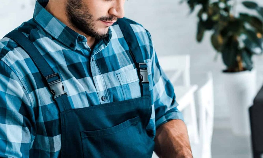 bearded-handyman-pointing-with-finger-at-digital-tablet.jpg